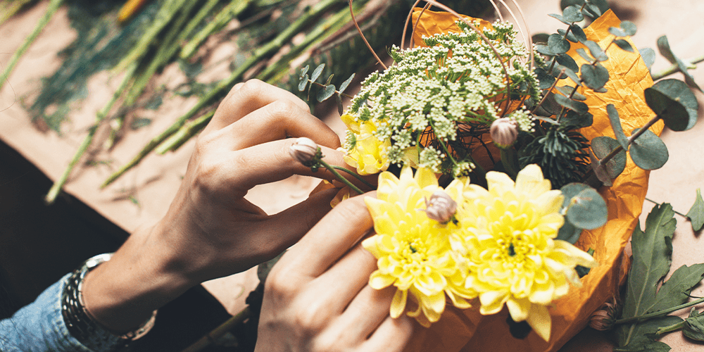 salisbury at enjoy floral studio woman arranging cut flowers