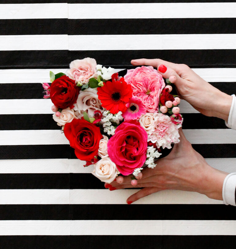 Salisbury Greenhouse-Alberta- All You Need To Know About Valentines Day-holding flowers