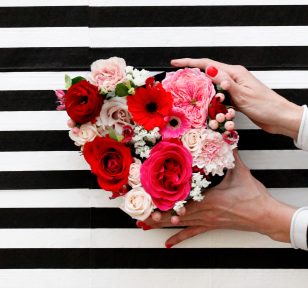 Salisbury Greenhouse-Alberta- All You Need To Know About Valentines Day-holding flowers