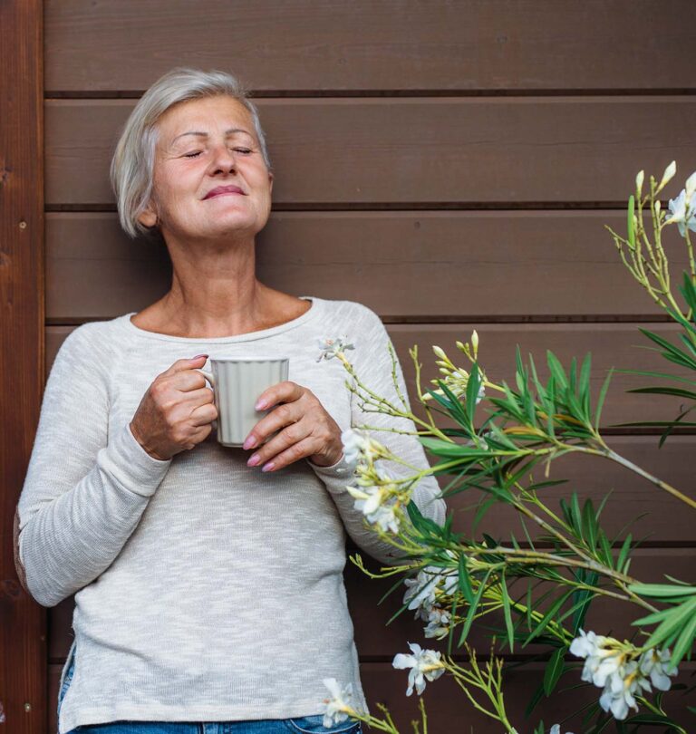 salisbury greenhouse - woman relaxing in her garden