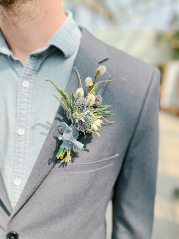 Woodsy Boutonniere on Grey suit | Salisbury Floral Studio - St. Albert